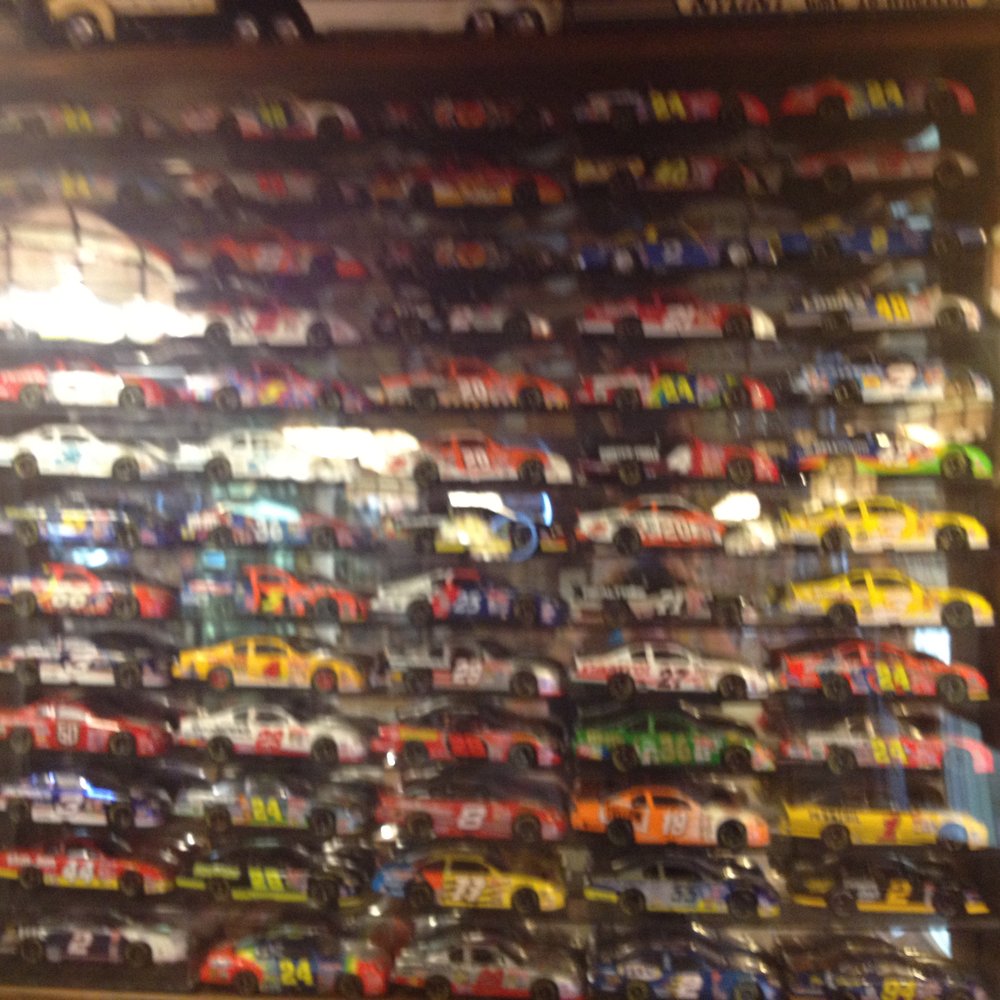 Darrell's Bar-B-Q - Just one of a number of wall displays of small racing cars. - Barbeque Near Me - Rockwell, North Carolina Darrell's Bar-B-Q - Just one of a number of wall displays of small racing cars. - Barbeque Near Me - Rockwell, North Carolina