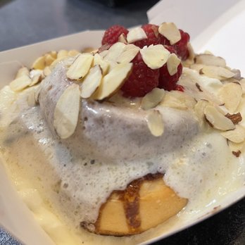 Cinnaholic - Cinnamon roll, Amaretto icing, raspberries and almonds - Bakeries Near Me - Gilbert, Arizona