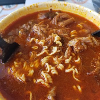 Birrieria Guadalajara - Stages of birra ramen with onions, lime  and cilantro - Mexican Near Me - Stanton, California
