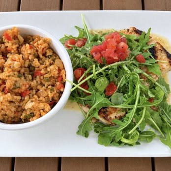 Harry's Seafood Bar & Grille - Mahi with Arugula and Nola rice - Seafood Near Me - St Augustine, Florida Harry's Seafood Bar & Grille - Mahi with Arugula and Nola rice - Seafood Near Me - St Augustine, Florida