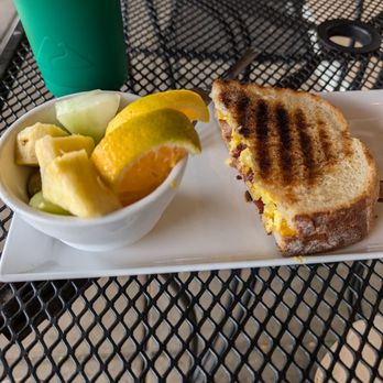 Russell’s Cafe & Bakery - Sunrise on sourdough breakfast sandwich with fruit - Breakfast & Brunch Near Me - Fenton, Missouri Russell’s Cafe & Bakery - Sunrise on sourdough breakfast sandwich with fruit - Breakfast & Brunch Near Me - Fenton, Missouri