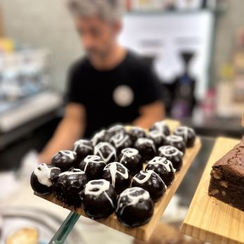 Aromes Sant Andreu  - Dark chocolate truffles with a playful touch -- small bites of pure indulgence waiting at the counter. - Cafeteria Near Me - Barcelona, B