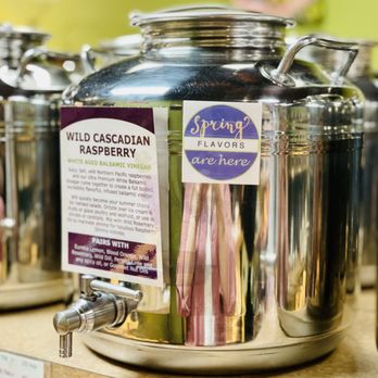 The Olive Scene - a variety of silver containers with labels on them - Olive Oil Near Me - Rocky River, Ohio
