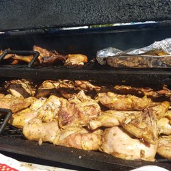 Malvo's Chill Spot - Malvo's famous jerk chicken been prepared on the grill