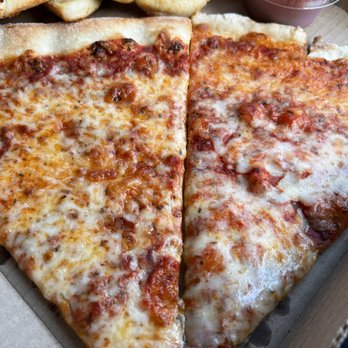 Old School Pizzeria - regular cheese slice (left) gluten-free cheese slice (right) - Pizza Near Me - Olympia, Washington Old School Pizzeria - regular cheese slice (left) gluten-free cheese slice (right) - Pizza Near Me - Olympia, Washington