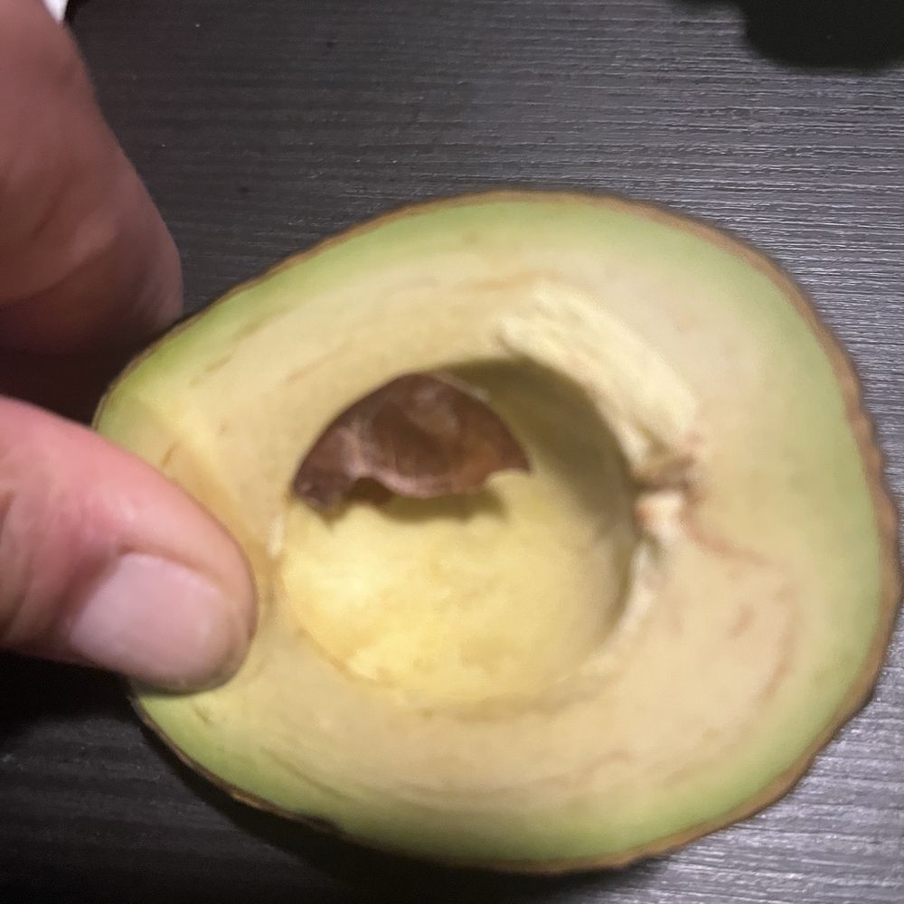 I'm pushing hard on this avocado, next picture you'll be able to see the indent, I bought this avocado 3 days ago
