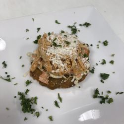 Luna Latin Cuisine - Shredded chicken tostones (fried green plantains topped w/ slaw, shredded chicken and Queso Fresco)