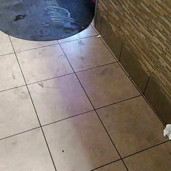 Angelos 2 - A section of the dirty floor and mat (the trashcan was on this floor...). - Burgers Near Me - Garden Grove, California Angelos 2 - A section of the dirty floor and mat (the trashcan was on this floor...). - Burgers Near Me - Garden Grove, California