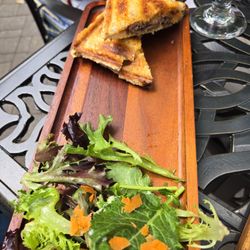 Earl of Sandwich with kind of a salad. Needed extra dressing & nothing else on it. Friend's salad also had tomatoes but I got none.
