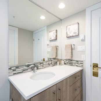 Vancouver General Contractors - a bathroom with a sink and mirror - Interior Design Near Me - Vancouver, British Columbia Vancouver General Contractors - a bathroom with a sink and mirror - Interior Design Near Me - Vancouver, British Columbia