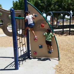 Centennial Park - Look beyond the rock climbing wall and you will see a swing set with no swings. How convenient!