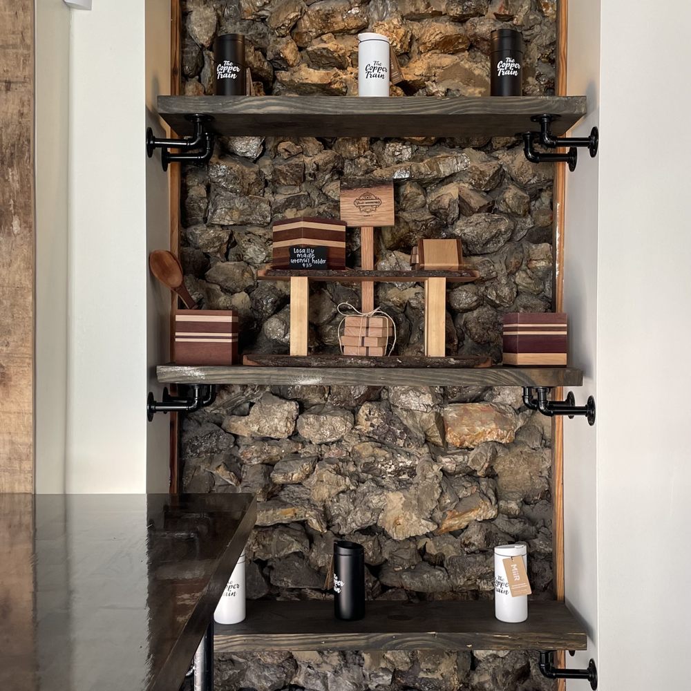 Merch includes some local artisan's woodworking + cool shelving!
