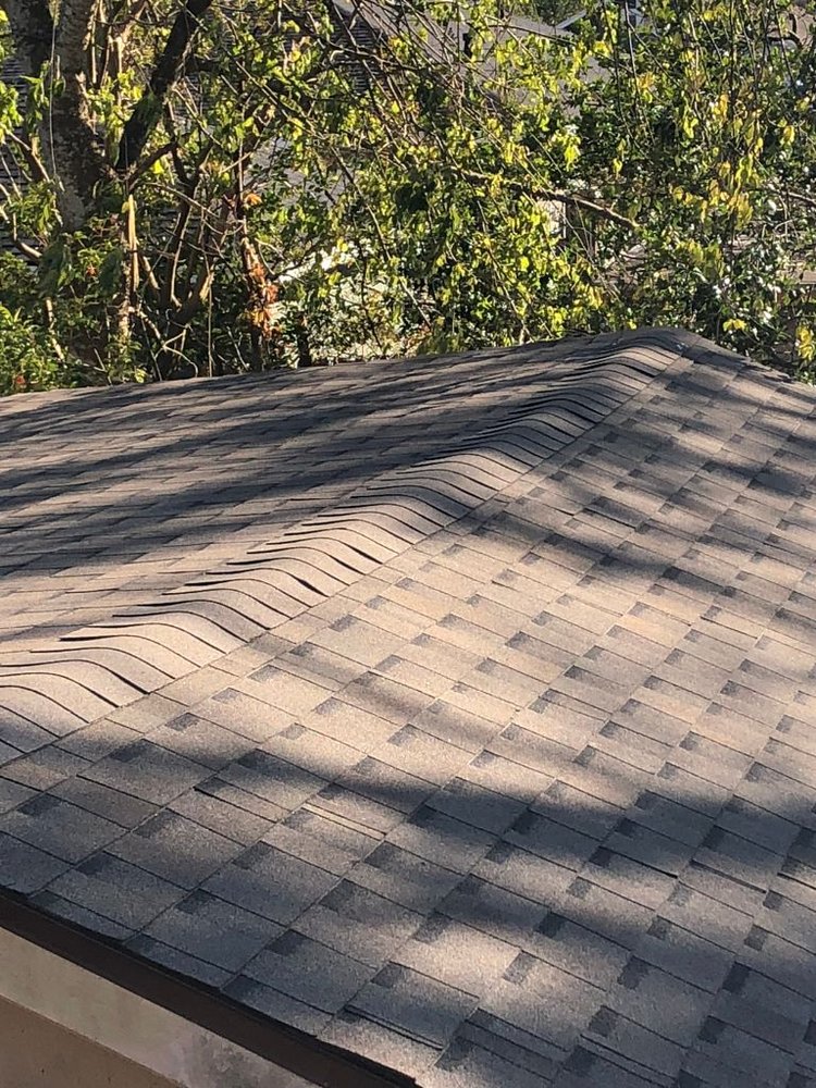 Slide of Pelican Roofing Company