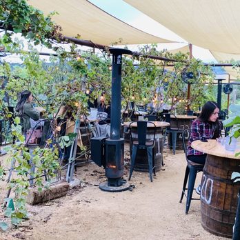 In Contrada Vineyard and Kitchen - Heat lamps and lights in the outdoor courtyard dining area :) ! - Wine Tasting Room Near Me - San Antonio, Texas