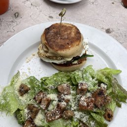 Portobello & goat cheese breakfast sandwich with a Caesar side salad