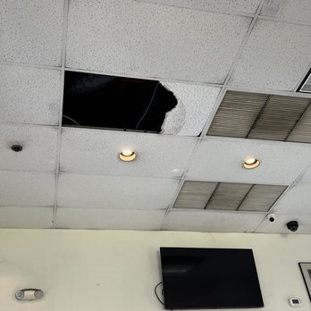 Fatburger - Missing ceiling tiles. Dirty vents - Burgers Near Me - West Hollywood, California