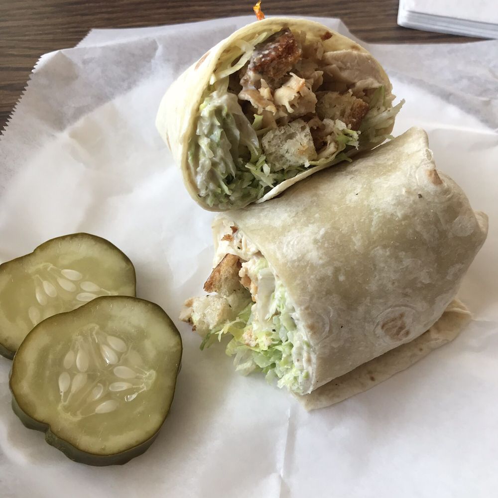 Grilled Chicken Cesar wrap - complimentary pickles and warm fresh chicken. Yum. Grilled Chicken Cesar wrap - complimentary pickles and warm fresh chicken. Yum.