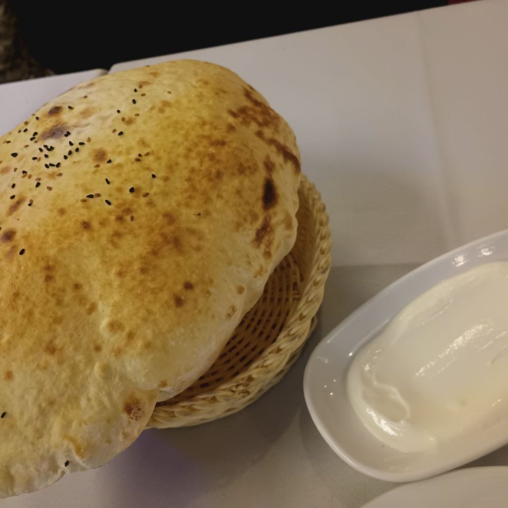 Steam puffed flat bread with yogurt dipping