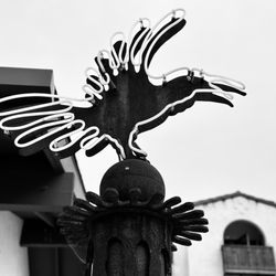 Santa Barbara Arts Collaborative at the Community Arts Workshop - Crow symbol with neon in noir