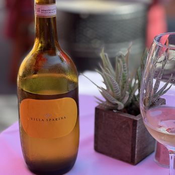 Gravina Malibu - a bottle of wine and a glass - Italian Near Me - Malibu, California Gravina Malibu - a bottle of wine and a glass - Italian Near Me - Malibu, California