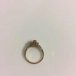 10K Ring re-shaped. Was bent into an oval and unwearable. 10K Ring re-shaped. Was bent into an oval and unwearable.