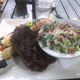 Steak with veggies and a Caesar salad