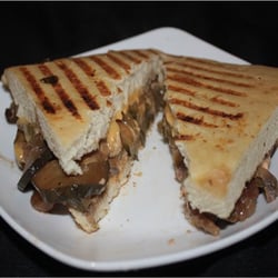 The Baker's Loaf - Veggie panini: Portobello mushrooms, cucumbers, red onions, zucchini, roasted peppers, American heese, red pepper mayo on Focacc