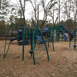 Playset on top of the hill near the basketball parking