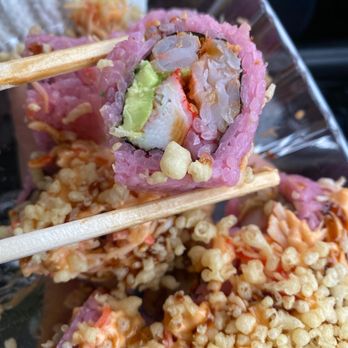 Sushi Go - chopsticks holding a piece of sushi - Sushi Bars Near Me - Allen, Texas Sushi Go - chopsticks holding a piece of sushi - Sushi Bars Near Me - Allen, Texas
