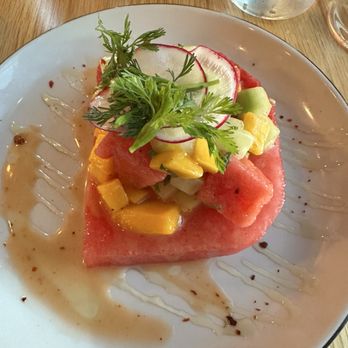 Isa Bistro - Watermelon Salad with honey drizzle, mangoes, and pickled cucumber. - New American Near Me - Portland, Maine