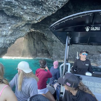 Na Pali Pirates - Erica maneuvering just one of the many caves. Expert!! - Boat Tours Near Me Na Pali Pirates - Erica maneuvering just one of the many caves. Expert!! - Boat Tours Near Me