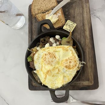 Mornings Breakfast & Brunch - Build-your-own skillet: hash browns, broccoli, caramelized onions, and turkey sausage with over medium egg - Breakfast & Brunch Near Me - Indianapolis, Indiana