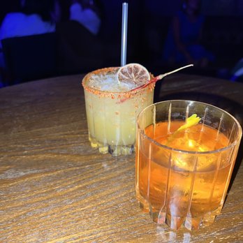 Dirty Laundry - two cocktails on a wooden table - Speakeasies Near Me - Fort Worth, Texas