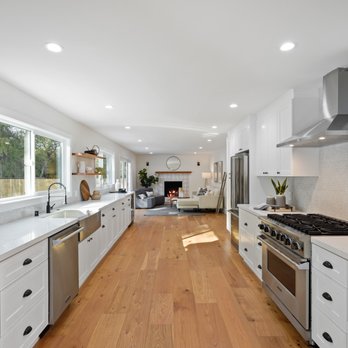 BuildRight Construction - a kitchen with white cabinets and wood floors - General Contractors Near Me - San Jose, California