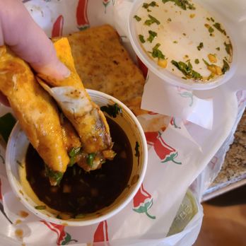 Taqueria El Comal - a hand dipping a taqueria into a bowl - Mexican Near Me - Hamilton, Ohio Taqueria El Comal - a hand dipping a taqueria into a bowl - Mexican Near Me - Hamilton, Ohio
