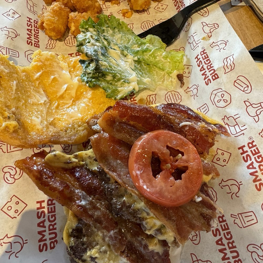 Smash Burger double bacon smash. One thin slice of Roma tomato. Smash Burger double bacon smash. One thin slice of Roma tomato.
