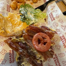 Smash Burger double bacon smash. One thin slice of Roma tomato.