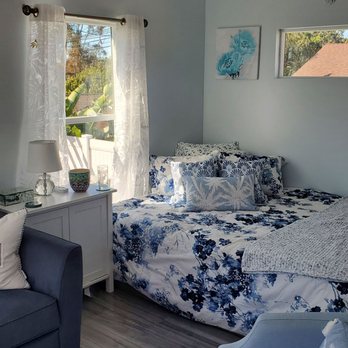 Black Dog West Construction - a living room with a couch and a bed - General Contractors Near Me - San Diego, California