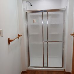 Evolution Shaping Expressions - Here, we replaced a walk-in shower, and we also added a recessed light in the shower so there would be more light while bathing.
