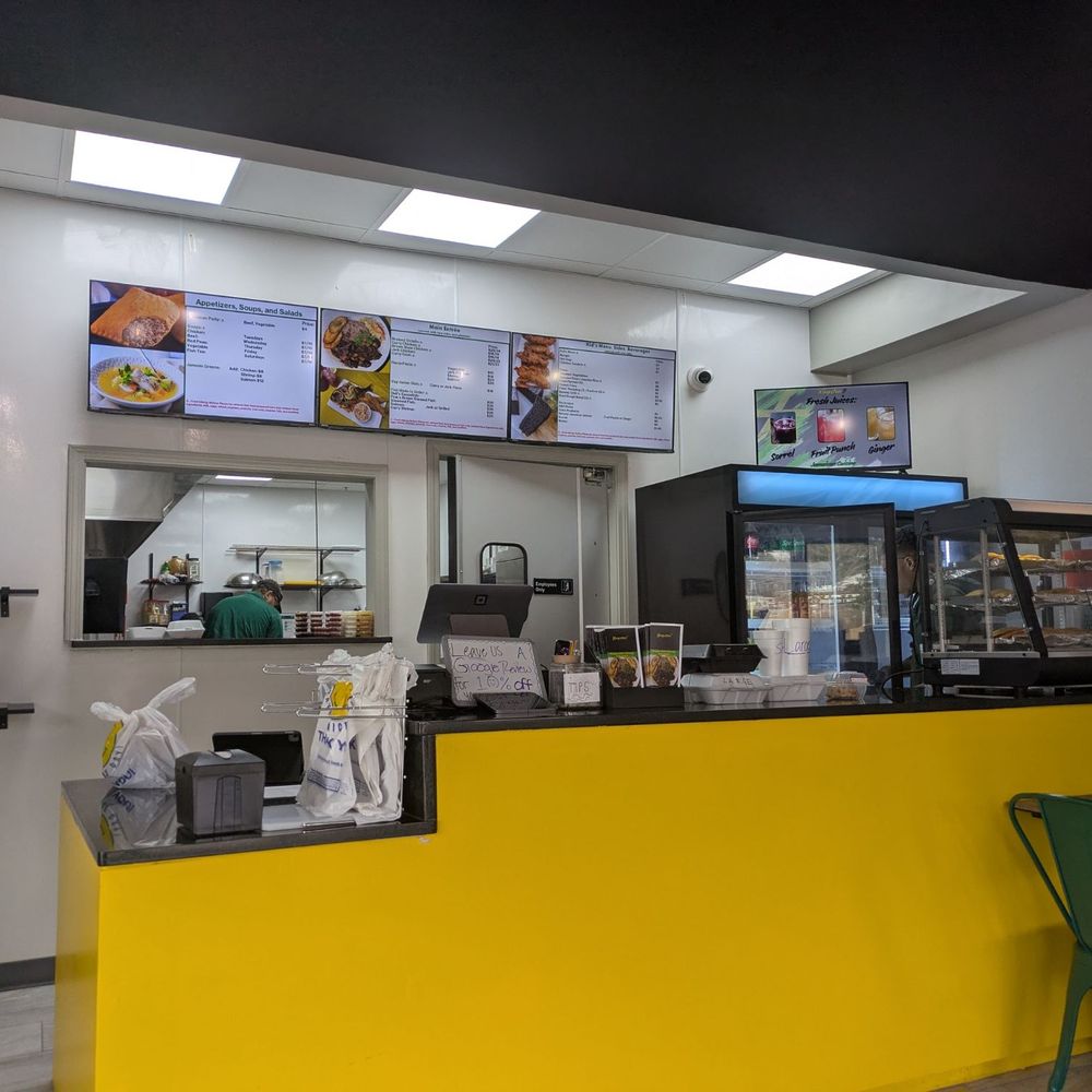 Kingston 7 Jamaican Cuisine - Small storefront with several tables and great ambiance - Caribbean Near Me - Woodstock, Georgia Kingston 7 Jamaican Cuisine - Small storefront with several tables and great ambiance - Caribbean Near Me - Woodstock, Georgia