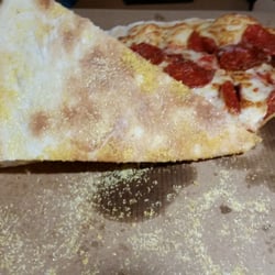 Little Caesars Pizza - Disgusting globs of raw cornmeal that crunch like sand in your teeth with every bite. Inedible.