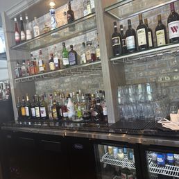 a bar filled with bottles of alcohol