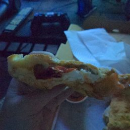 Some sausage and pepperoni calzone I didn't order. No spinach is in this. Some sausage and pepperoni calzone I didn't order. No spinach is in this.