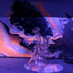 Red Glass Gallery - This is a piece featured in there black light room, it changes colors from clear to pink