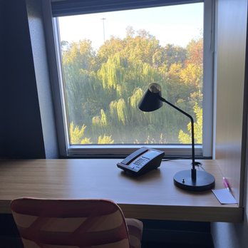 Aloft by Marriott Nashville Franklin - Desk area with pretty wooded view (but concealing nearby highway). - Hotels Near Me - Franklin, Tennessee
