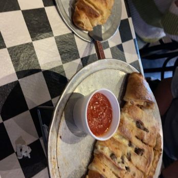 Wise Guys Pizzeria - Small and I think it's a large or medium calzon with marinara sauce - Pizza Near Me - Orange, California Wise Guys Pizzeria - Small and I think it's a large or medium calzon with marinara sauce - Pizza Near Me - Orange, California