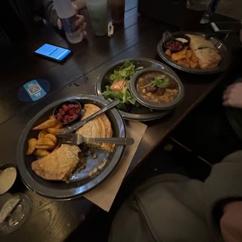 Leaky Cauldron™ - Vegan Shepherds Pasty Pie w/ wedge potatoes & small beet salad. Middle is the Vegan Beef Stew with a side salad. - British Near Me - Orlando, Florida