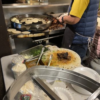 Taqueria El Ramy - The Chef working his magic - Tacos Near Me - Madera, California Taqueria El Ramy - The Chef working his magic - Tacos Near Me - Madera, California