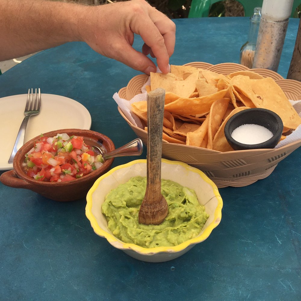 Coconuts Bar & Grill - Homemade guacamole with chips and spicy salsa - Bars Near Me - Cozumel, ROO Coconuts Bar & Grill - Homemade guacamole with chips and spicy salsa - Bars Near Me - Cozumel, ROO