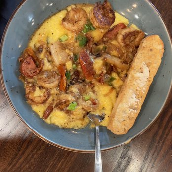 First Watch - Creamy cheesy grits with shrimp, sausage, peppers and sun dried tomatoes. I found it to be good, minus the sun dried tomatoes. - Breakfast & Brunch Near Me - Louisville, Kentucky First Watch - Creamy cheesy grits with shrimp, sausage, peppers and sun dried tomatoes. I found it to be good, minus the sun dried tomatoes. - Breakfast & Brunch Near Me - Louisville, Kentucky
